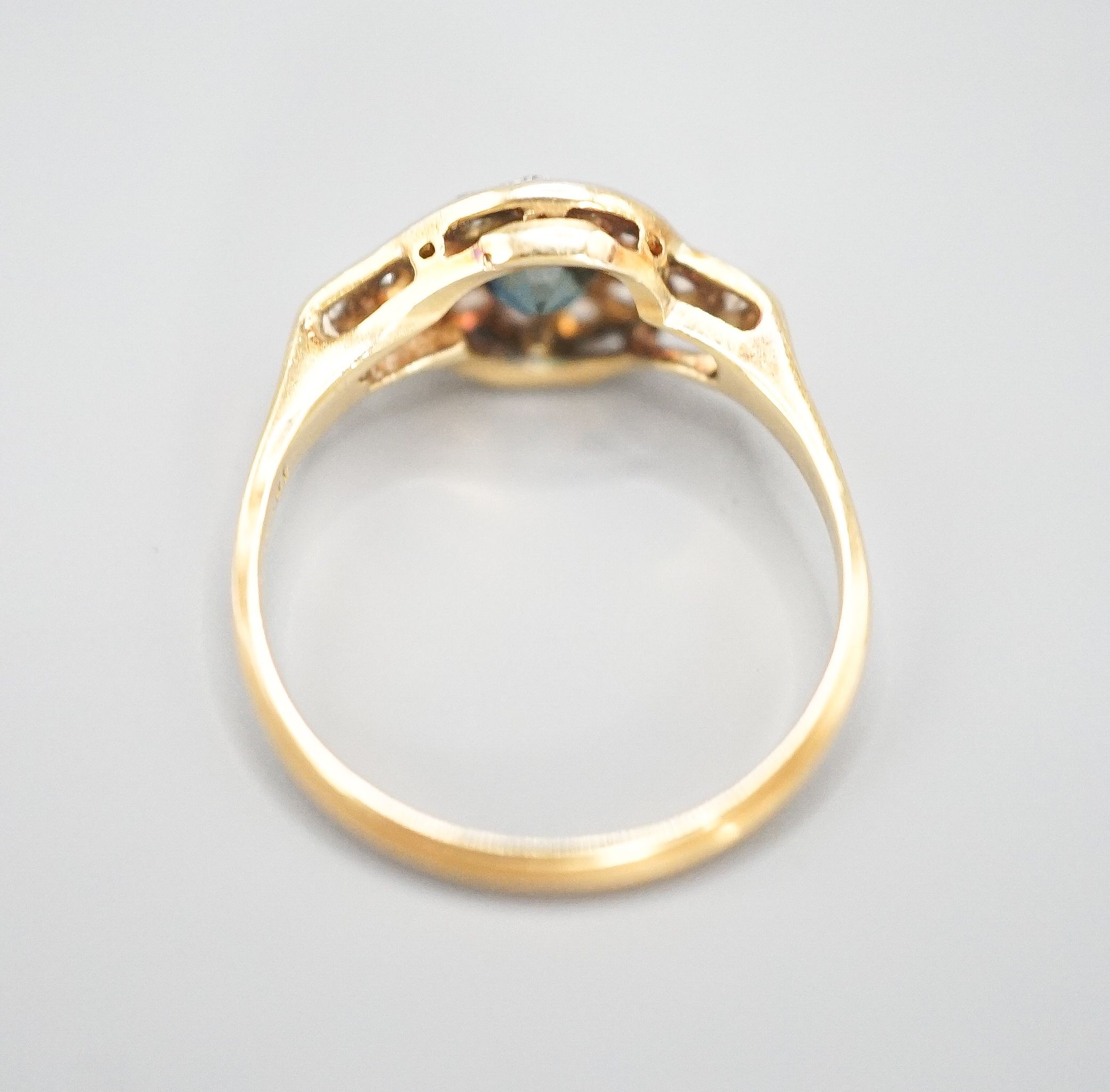 An early to mid 20th century 18ct, sapphire and diamond set cluster ring, size N/O, gross weight 2.6 grams.